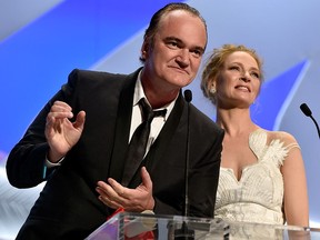 Quentin Tarantino and Uma Thurman appear on stage to give the Palme d'Or award during the closing ceremony at the 67th Annual Cannes Film Festival on May 24, 2014 in Cannes, France. (Pascal Le Segretain/Getty Images)