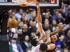 Toronto Raptors Jonas Valanciunas dunks one in during overtime action against the Milwaukee Bucks at the Air Canada Centre in Toronto, Ont. on Friday February 23, 2018. Ernest Doroszuk/Toronto Sun/Postmedia Network