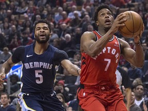 Toronto Raptors guard Kyle Lowry (7) drives past Memphis Grizzlies guard Andrew Harrison (5) during NBA action in Toronto on Sunday, February 4, 2018. (THE CANADIAN PRESS/Chris Young)