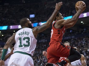 Raptors' DeMar DeRozan goes to the basket past Celtics defender Marcus Morris in Toronto on Tuesday, February 6, 2018. (THE CANADIAN PRESS/Chris Young)
