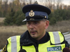 OPP Sgt. Kerry Schmidt speaks to media at a crash scene on Hwy. 400 south of Barrie, Ont., on Wednesday, November 1, 2017. (file photo)