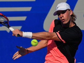 Denis Shapovalov returns the ball to Japan's Kei Nishikori (out of frame) during their Mexico ATP 500 Open men's singles tennis match in Acapulco, Guerrero state on Feb. 27, 2018