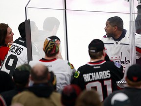 Washington Capitals right wing Devante Smith-Pelly (25) argues with Chicago Blackhawks fans from the penalty box Saturday, Feb. 17, 2018, in Chicago. (AP Photo/Jeff Haynes)