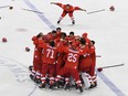 Russian players celebrate their Olympic hockey gold medal on Feb. 25.