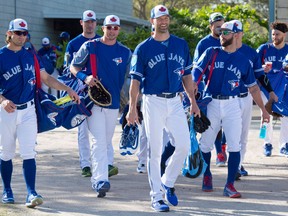 Left to right, Toronto Blue Jays outfielder Randal Grichuk, pitcher John Axford, first baseman Justin Smoak, pitcher J.A. Happ, outfielder Kevin Pillar and catcher Russel Martin arrive at spring training in Dunedin on Feb. 21, 2018