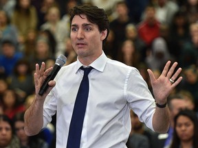 Prime Minister Justin Trudeau answers questions at his cross country town hall meeting at MacEwan University in Edmonton, Feb. 1, 2018. (Ed Kaiser/Postmedia)