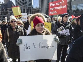 Demonstrators protest against Islamophobia and for free speech clash at City Hall in Toronto, Ont. on Saturday March 4, 2017. (Craig Robertson/Toronto Sun/Postmedia Network)