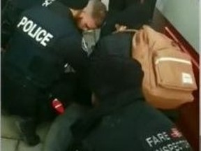 Cops and a TTC fare inspector pin a teen to the ground in an incident that has triggered three probes.
