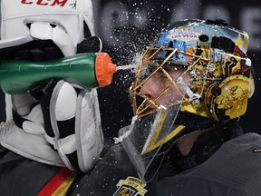 Marc-Andre Fleury of the Vegas Golden Knights takes a drink during an NHL game against the Columbus Blue Jackets at T-Mobile Arena on Jan. 23, 2018