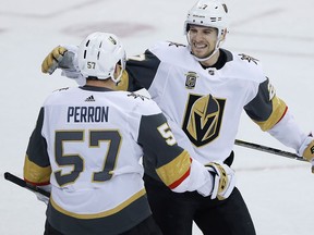 David Perron, left, and Shea Theodore celebrate a Vegas Golden Knights goal on Feb. 1, 2018