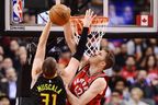 Atlanta Hawks' Mike Muscala has his shot blocked by Raptors centre Jakob Poeltl during Tuesday's game. (THE CANADIAN PRESS)