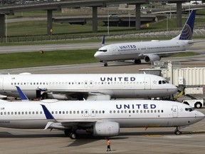 In this July 8, 2015, file photo, United Airlines planes are seen on the tarmac at the George Bush Intercontinental Airport in Houston.