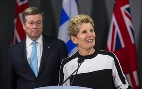 Premier Kathleen Wynne and Mayor John Tory address the media after meeting at City Hall. (Ernest Doroszuk, Toronto Sun)