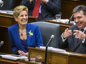 Ontario Finance Minister Charles Sousa gestures after delivering his budget on Wednesday. (ERNEST DOROSZUK, Toronto Sun)