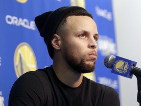 Golden State Warriors guard Stephen Curry speaks at a news conference on Sunday. (AP PHOTO)