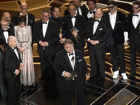 Guillermo del Toro and the cast and crew of "The Shape of Water" accept the award for best picture at the Oscars on Sunday, March 4, 2018, at the Dolby Theatre in Los Angeles. (Photo by Chris Pizzello/Invision/AP) ORG XMIT: CADA365