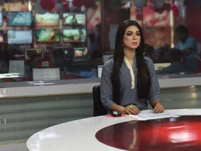 In this photograph taken on March 27, 2018, Pakistan's first transgender news anchor Marvia Malik, 21, reads the news on air for the private channel Kohenoor in Lahore.