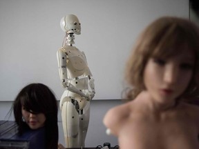 This photo taken on February 1, 2018 shows robots in a lab of a doll factory of EXDOLL, a firm based in the northeastern Chinese port city of Dalian.