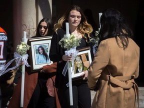 Victoria Pejcinovski, 16, the sister/daughter exits the funeral for triple homicide victims Krassimira, Roy, and Venallia Pejcinovski of Ajax at the St. Demetrios Greek Orthodox Church in Toronto on Saturday, March 24, 2018.