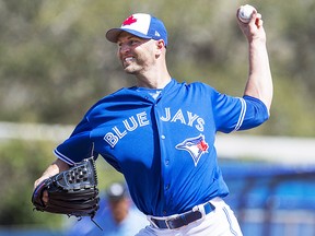 Toronto Blue Jays starting pitcher J.A. Happ pitches to the Detroit Tigers during first inning exhibition baseball action in Dunedin, Fla. on Sunday, February 25, 2018. THE CANADIAN PRESS/Frank Gunn ORG XMIT: FNG104