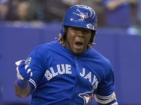 Blue Jays' Vladimir Guerrero Jr. celebrates his walk-off home run to defeat the Cardinals 1-0 during ninth inning spring training baseball action in Montreal. (THE CANADIAN PRESS/Paul Chiasson)