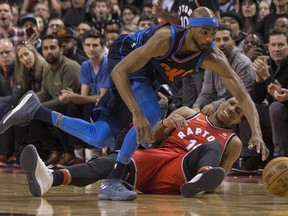 Thunder’s Corey Brewer (left) battles for a loose ball with the Raptors’ DeMar DeRozan during second half at the ACC.
THE CANADIAN PRESS/Chris Young