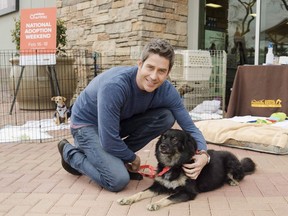 Arie Luyendyk Jr., star of ABC's "The Bachelor," cuddles with his dog Bastian in Phoenix, Ariz., on Friday, Feb. 16, 2018. The reality dating series "The Bachelor" hit its 16th anniversary on Sunday and, despite a rocky past year and poor track record of diversity and lasting love connections, its rose petals show no signs of wilting. THE CANADIAN PRESS/AP-Mark Peterman/AP Images for PetSmart Charities)