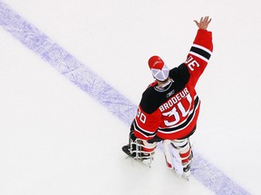 Goaltender Martin Brodeur of the New Jersey Devils salutes the crowd after defeating the Chicago Blackhawks and becoming the NHL's all-time winningest goaltender on March 17, 2009