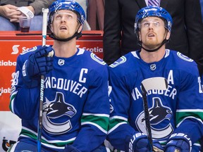 Henrik Sedin, left, and Daniel Sedin during an NHL game on Nov. 6, 2017