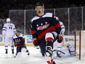 Washington Capitals defenceman John Carlson celebrates his goal against the Maple Leafs in the second period last night during their outdoor game at Navy-Marine Corps Memorial Stadium in Annapolis, Md. (Patrick Smith/Getty Images)