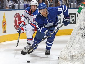 David Desharnais of the New York Rangers chases Connor Carrick of the Toronto Maple Leafs at the Air Canada Centre on October 7, 2017 in Toronto. (Claus Andersen/Getty Images)