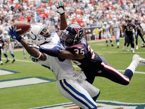 In this Oct. 5, 2008, file photo, Indianapolis Colts wide receiver Reggie Wayne makes a one handed touchdown catch