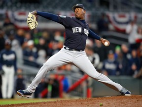 New York Yankees relief pitcher Aroldis Chapman delivers in the ninth inning of a spring training baseball game against the Atlanta Braves on March 26, 2018