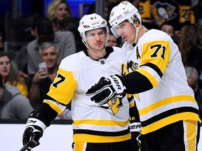 Sidney Crosby and Evgeni Malkin of the Pittsburgh Penguins talk before a faceoff against the Los Angeles Kings at Staples Center on January 18, 201 in Los Angeles. (Harry How/Getty Images)