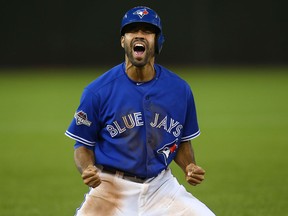 Dalton Pompey of the Toronto Blue Jays reacts after a teammate's home run against the Texas Rangers on Oct. 14, 2015