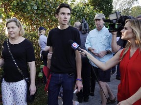 Student David Hogg speaks to the media as he returns to Marjory Stoneman Douglas High School in Parkland, Fla., Feb. 28, 2018.