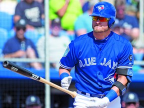 Toronto Blue Jays Josh Donaldson tosses his bat as he walks to first base  during a recent exhibition game. THE CANADIAN PRESS/Frank Gunn