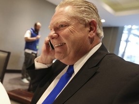Doug Ford on the phone at the Ontario PC leadership convention on Saturday, March 10, 2018.