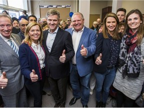 Official opening of the campaign office for Ajax Ontario PC candidate Rod Phillips in Ajax, Ont. on Saturday March 24, 2018. From left are – Lorne Coe, Christine Elliott, Rod Phillips, Doug Ford, Caroline Mulroney and Lindsey Park. (Ernest Doroszuk/Toronto Sun/Postmedia Network)