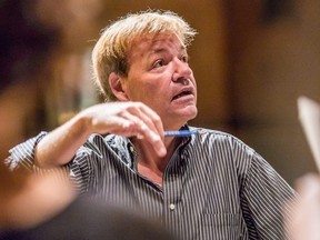 Conductor Noel Edison leads the Elora Festival Singers in rehearsal  in 2013. (Bill Blackstone/Postmedia)