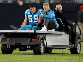 In this Nov. 17, 2016, file photo, Carolina Panthers linebacker Luke Kuechly (59) is taken off the field after being injured in the second half of an NFL football game against the New Orleans Saints, in Charlotte