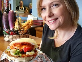 Patricia serves up an amazing sandwich from Parmigiana Sandwiches in Woodbridge, while her mother, Rosa Francavilla and assistant Valentina, watch from the kitchen.