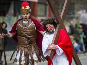 Giuseppe Rauti, portrays Jesus Christ being led by Roman soldiers in a Station of the Cross during the St. Francis of Assisi Church Toronto Good Friday Procession in the Little Italy area in Toronto, Ont. on Friday March 30, 2018.