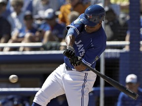 Toronto Blue Jays outfielder Curtis Granderson connects for a double off Baltimore Orioles pitcher Miguel Castro Friday, March 9, 2018, in Dunedin, Fla. (AP Photo/Chris O'Meara)