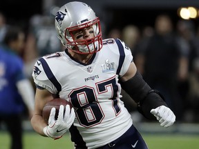 In this Feb. 4, 2018, photo, New England Patriots tight end Rob Gronkowski (87) warms up before Super Bowl 52 against the Philadelphia Eagles in Minneapolis. (AP Photo/Chris O'Meara)