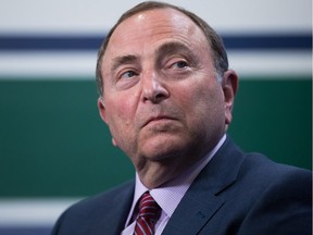 NHL commissioner Gary Bettman listens after announcing the 2019 NHL Entry Draft will be held in Vancouver, during a news conference in Vancouver on February 28, 2018.
