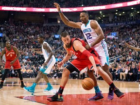 Toronto Raptors centre Jonas Valanciunas battles for the ball with Charlotte Hornets centre Dwight Howard during an NBA game on March 4, 2018