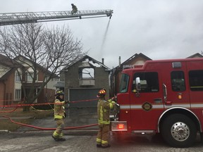 Pickering firefighters at the scene of a blaze on Echo Point Court on Wednesday, March 28, 2018. (Kevin Connor/Toronto Sun)