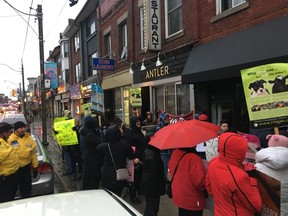 A group of animal rights activists protest outside of Antler on Saturday, March 31, 2018.