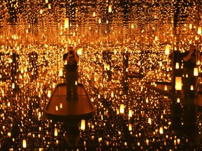 Toronto Sun photographer Jack Boland inside the "Aftermath of Obliteration Eternity" at the Infinity Mirrors exhibition - by Japanese artist Yayoi Kasuma at the Art Gallery of Ontario. A visual fest of lights, sculpture, pantings and photographs on Thursday March 1, 2018.